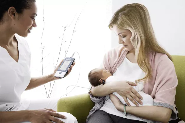 Transferring newborn results to HearSIM™ for review and printing.